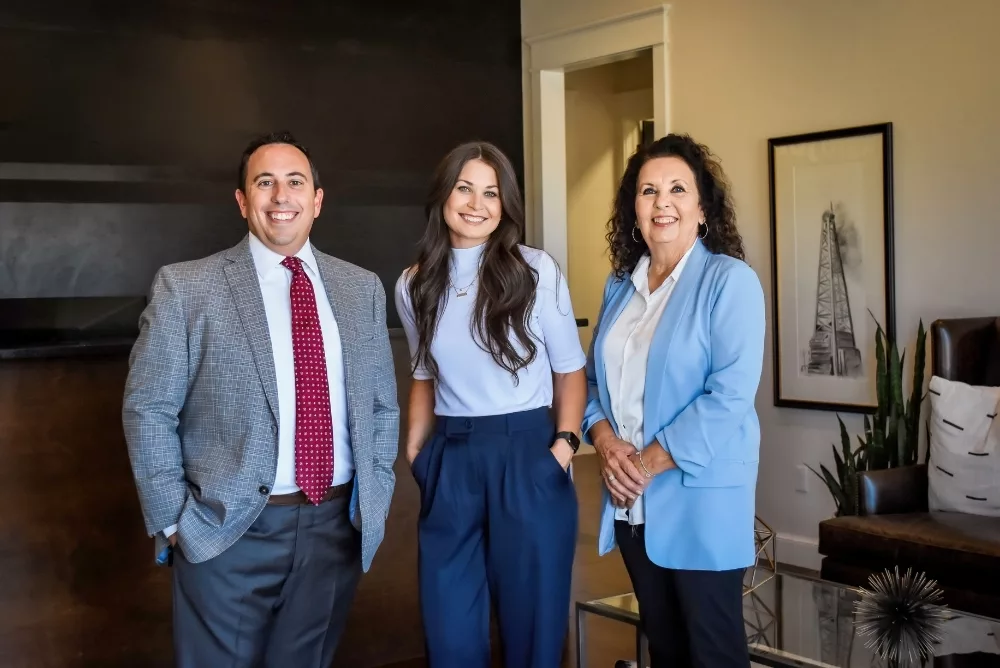Justin Koch, Kari Payne & Joy York of Copper Sky Wealth Financial Advisors pose in their office in Elk City, Oklahoma